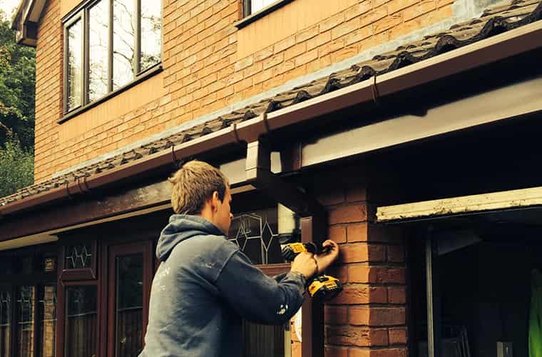 Telford Roofers working on guttering project in Telford